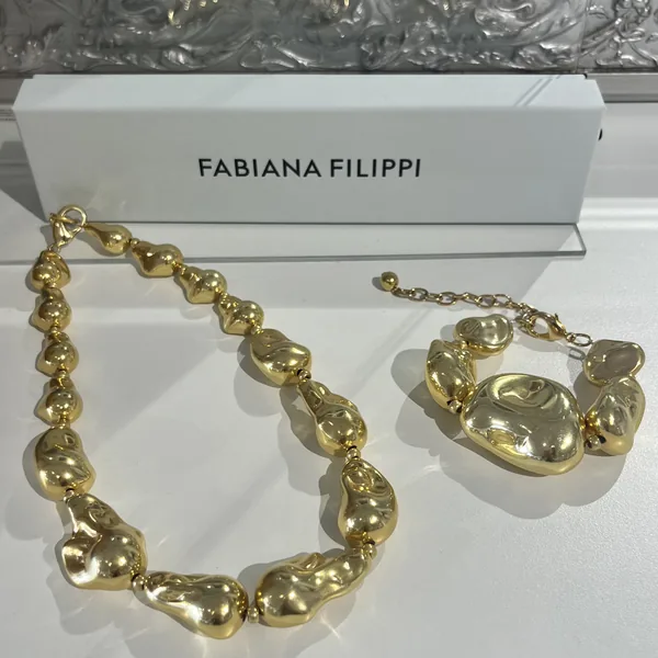 Fabiana Filippi gold nugget necklace and bracelet styled at Lejose Fashion House