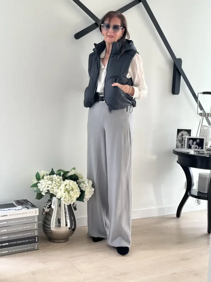 Puffer vest and tailored trousers styled at Lejose Fashion House