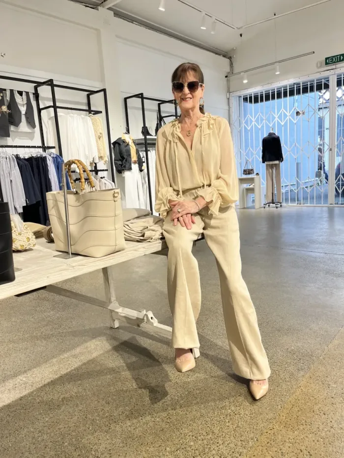Ruffled blouse and wide-leg trousers styled at Lejose Fashion House