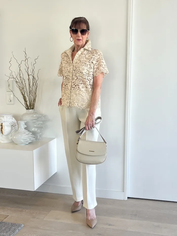Cream lace shirt and tailored trousers styled at Lejose Fashion House
