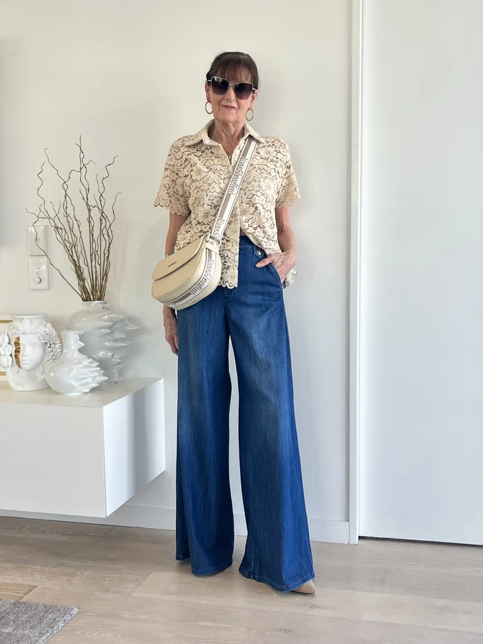 Cream lace shirt and wide-leg denim styled at Lejose Fashion House