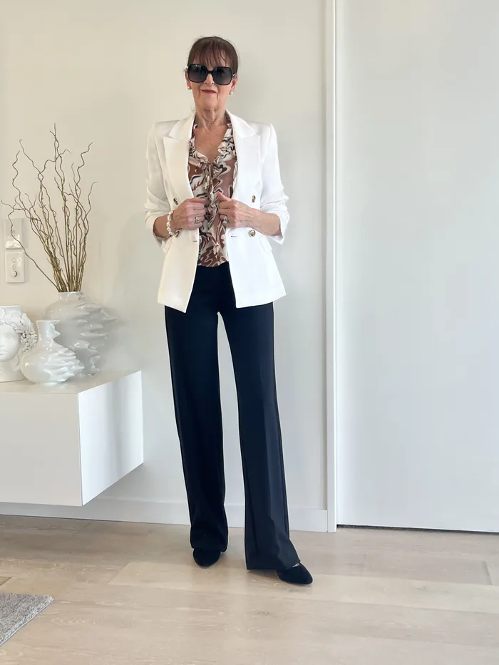 White blazer and black tailored trousers styled at Lejose Fashion House