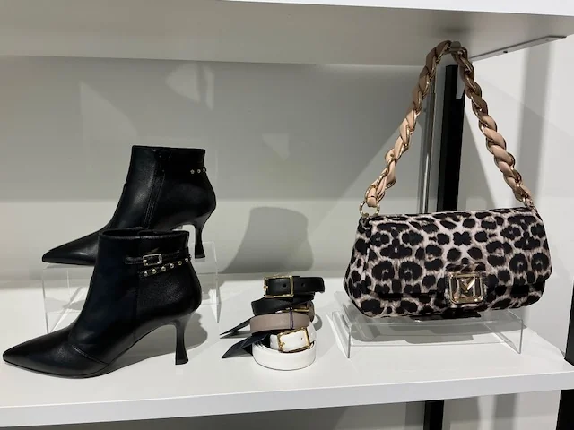 Leather ankle boots, belts and leopard print bag, in-store at Lejose Fashion House
